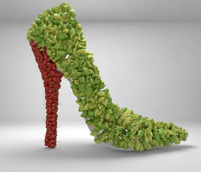 A high heel built from lime wedges with a heel covered in cherries.